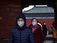 BEIJING, CHINA - JANUARY 27: Chinese visitors wear protective masks as they tour the Temple of Heaven, which remained open during the Chinese New Year and Spring Festival holiday on January 27, 2020 in Beijing, China. The number of cases of a deadly new coronavirus rose to over 2700 in …