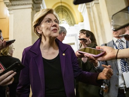 WASHINGTON, DC - JANUARY 27: Democratic Presidential Candidate Senator Elizabeth Warren answers questions from the press as she leaves after the Senate impeachment trial of President Donald Trump was adjourned for the day on January 27, 2020 in Washington, DC. The defense team continues its arguments on the sixth day …