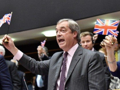 Britain's Brexit Party leader Nigel Farage holds a union flag during a European Parli