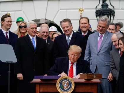 WASHINGTON, DC - JANUARY 29: U.S. President Donald Trump signs the United States-Mexico-Canada Trade Agreement (USMCA) during a ceremony on the South Lawn of the White House on January 29, 2020 in Washington, DC. The new U.S.-Mexico-Canada Agreement (USMCA) will replace the 25-year-old North American Free Trade Agreement (NAFTA) with …