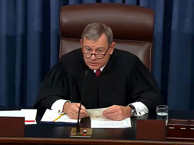 WASHINGTON, DC - JANUARY 29: In this screengrab taken from a Senate Television webcast, Chief Justice John Roberts reads a question from a senator during impeachment proceedings against U.S. President Donald Trump in the Senate at the U.S. Capitol on January 29, 2020 in Washington, DC. Senators have 16 hours …