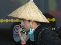 Passengers wear face masks to protect against the spread of the Coronavirus as they arrive on a flight from Asia at Los Angeles International Airport, California, on January 29, 2020. - A new virus that has killed more than one hundred people, infected thousands and has already reached the US …