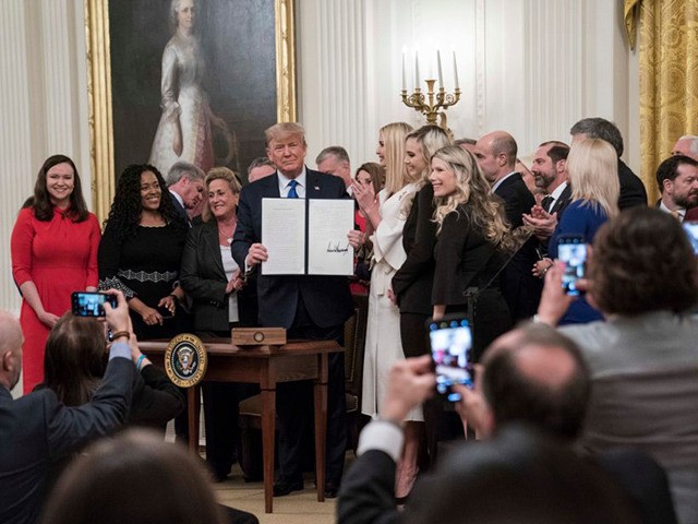 WASHINGTON, DC - JANUARY 31: US President Donald Trump signs an executive order to create