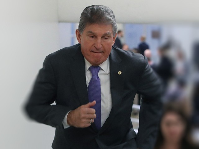 WASHINGTON, DC - JANUARY 21: Sen. Joe Manchin (D-WV) walks to the Senate Chamber at the U.S. Capitol January 21, 2020 in Washington, DC. Today marks day one of the Senate impeachment trial against President Trump. (Photo by Mark Wilson/Getty Images)