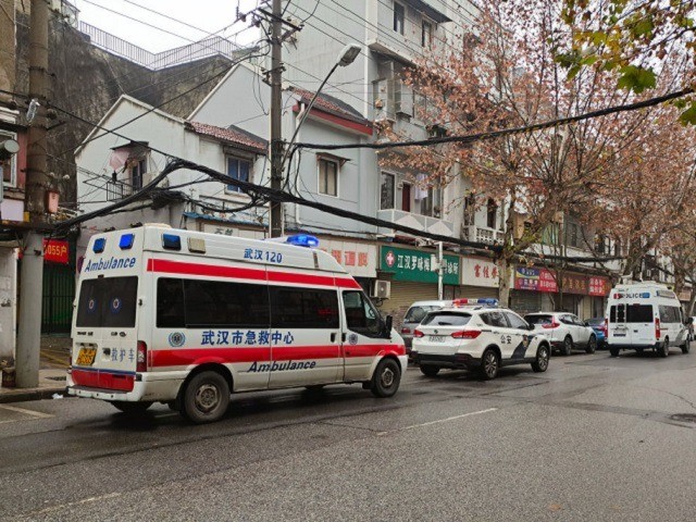 WUHAN, CHINA - JANUARY 22: An ambulance and police respond to a sick person on January 22, 2020 in Wuhan, China. The cause of the person's illness is as of yet unknown. A new infectious coronavirus known as "2019-nCoV" was discovered in Wuhan as the number of cases rose to …