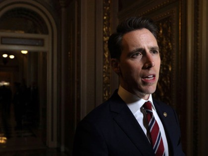 WASHINGTON, DC - JANUARY 22: U.S. Sen. Josh Hawley (R-MO) speaks to members of the media outside the Senate chamber during the Senate impeachment trial against President Donald Trump at the U.S. Capitol January 22, 2020 in Washington, DC. Opening arguments will be heard on day 2 of the Senate …
