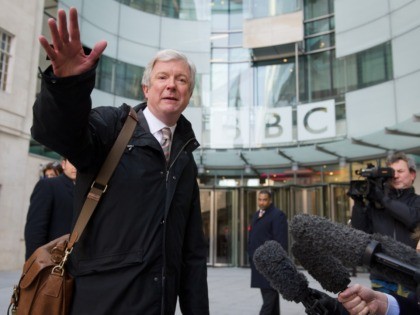 Tony Hall gestures as he arrives for his first day as Director General of the BBC at New B