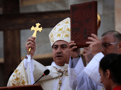Iraqi Archbishop Bashar Warda, the Chaldean Archbishop of Arbil, leads a mass celebrating the coronation of the Virgin Mary and attended by Iraqi Christians who fled the violence in the northern Iraqi city of Mosul, on May 31, 2015 in Arbil, the capital of the Kurdish autonomous region in northern …