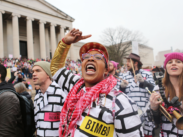 A woman chants while attending the Women's March on Washington on January 21, 2017 in Washington, DC. Large crowds are attending the anti-Trump rally a day after U.S. President Donald Trump was sworn in as the 45th U.S. president. (Photo by Mario Tama/Getty Images)