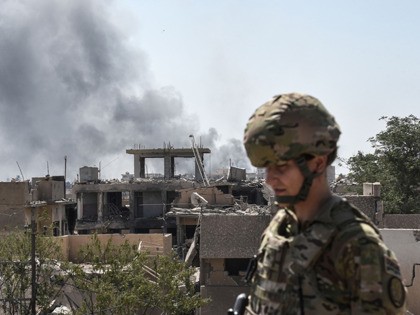 A US soldier advising Iraqi forces is seen in the city of Mosul on June 21, 2017, during t