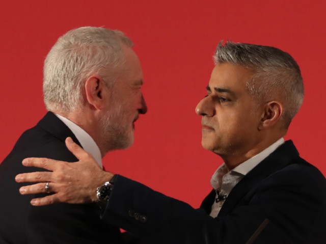 Britain's opposition Labour party leader Jeremy Corbyn (L) and The Mayor of London, Sadiq Khan embrace during the launch of Labours local election campaign in central London on April 9, 2018. / AFP PHOTO / Daniel LEAL-OLIVAS (Photo credit should read DANIEL LEAL-OLIVAS/AFP via Getty Images)