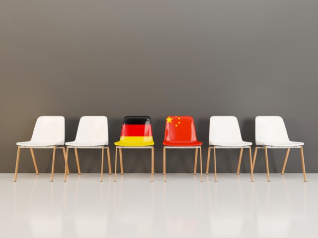 Chairs with flag of Germany and china in a row. 3D illustration