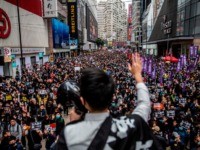 TOPSHOT - People take part in a pro-democracy march in Hong Kong on January 1, 2020. - Tens of thousands of protesters marched in Hong Kong during a massive pro-democracy rally on New Year's Day, looking to carry the momentum of their movement into 2020. (Photo by ISAAC LAWRENCE / …
