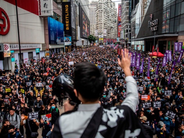 TOPSHOT - People take part in a pro-democracy march in Hong Kong on January 1, 2020. - Ten