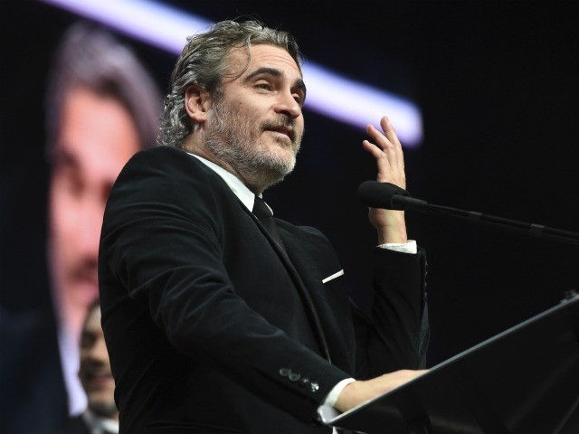 Joaquin Phoenix accepts the chairman's award for his role in "Joker" at the 31st annual Palm Springs International Film Festival Awards Gala on Thursday, Jan. 2, 2020, in Palm Springs, Calif. (AP Photo/Chris Pizzello)