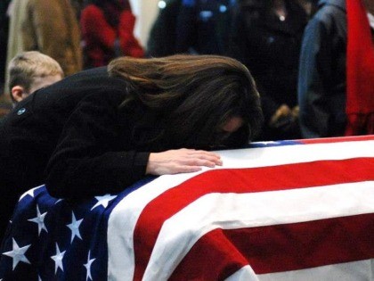 Kelly Terry-Willis holds the flag-draped casket of her brother, slain Border Patrol Agent Brian Terry. (Photo Courtesy of Kelly Terry-Willis)