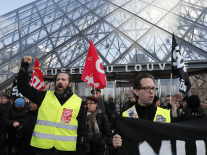 Striking employees demonstrate outside the Louvre museum Friday, Jan. 17, 2020 in Paris. Paris' Louvre museum was closed Friday as dozens of protesters blocked the entrance to denounce the French government's plans to overhaul the pension system. (AP Photo/Francois Mori)
