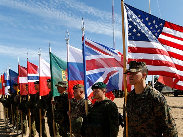 Soldiers from NATO countries attend a opening ceremony of military exercise 'Saber Strike 2015', at the Gaiziunu Training Range in Pabrade some 60km.(38 miles) north of the capital Vilnius, Lithuania, Monday, June 8, 2015. The annual multinational Exercise Saber Strike 2015 organized by the U. S. Army in Europe (USAREUR) …