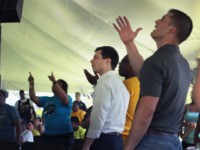Democratic presidential candidate and South Bend, Indiana mayor Pete Buttigieg (C) attends a community building event hosted by Christ Temple Apostolic Church on June 29, 2019 in South Bend, Indiana. The event was held as the funeral for Eric Logan was being held in nearby Mishawaka. Logan was shot and …