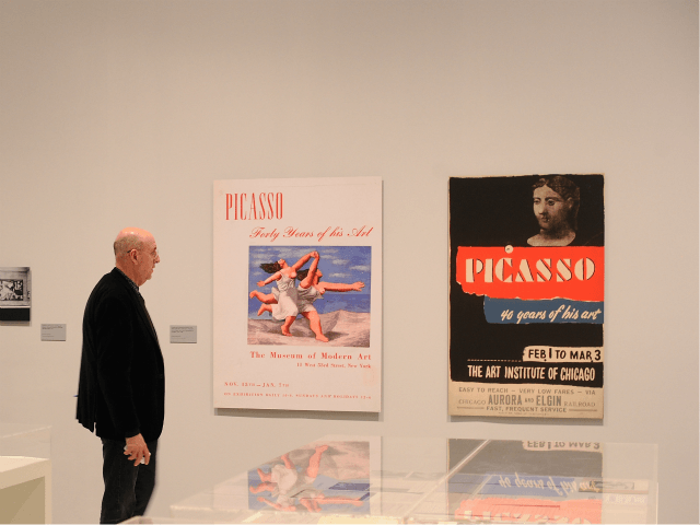 MADRID, SPAIN - APRIL 03: A member of the press views former posters of Picasso exhibition
