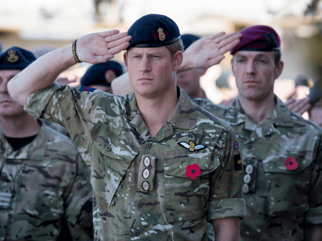 KANDAHAR, AFGHANISTAN - NOVEMBER 09: Prince Harry salutes as the Last Post is played as he