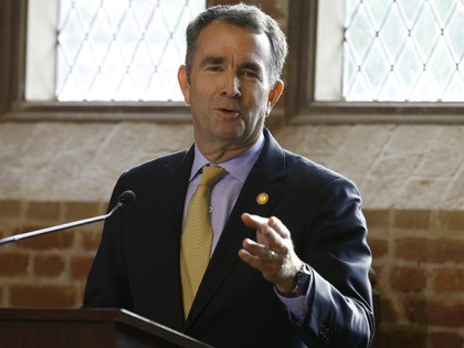 Virginia Gov. Ralph Northam addresses a commemorative meeting of the Virginia General Assembly on the 400th anniversary of the first House of Burgess meeting at a church in Historic Jamestown, Va., on the site where the meeting took place, Tuesday, July 30, 2019. President Donald Trump is scheduled to speak …