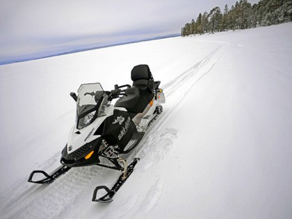 Snowmobile experience through wilderness of Lake Inari with VisitInari, Lapland, Finland.