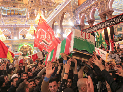 Mourners carry the coffins of slain Iraqi paramilitary chief Abu Mahdi al-Muhandis, Iranian military commander Qasem Soleimani and eight others inside the Shrine of Imam Hussein in the holy Iraqi city of Karbala,during a funeral procession on January 4, 2020. - Thousands of Iraqis chanting "Death to America" today as …