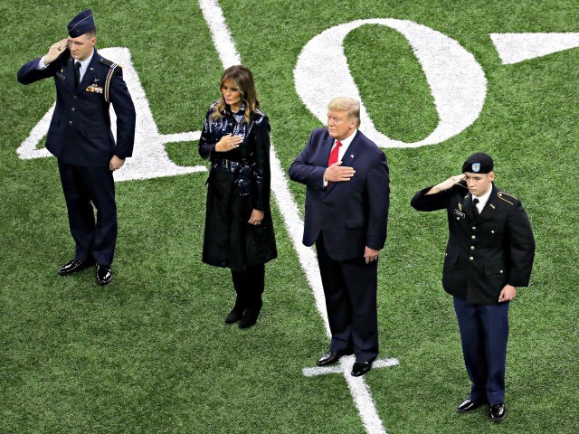 NEW ORLEANS, LOUISIANA - JANUARY 13: (L-R) First Lady Melania Trump and U.S. President Donald Trump stand for the national anthem prior to the College Football Playoff National Championship game between the Clemson Tigers and the LSU Tigers at Mercedes Benz Superdome on January 13, 2020 in New Orleans, Louisiana. …