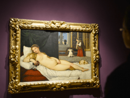 A woman looks at Titian's "Venus of Urbino" on April 23, 2013 in Venice, during the "Manet Return to Venice" exhibition, which runs until 18 August 2013, at the Doge's Palace in Venice. Edouard Manet's "Olympia" will be appearing alongside the a masterpice of Renaissance and source of ispiration for …
