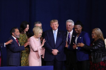 MIAMI, FLORIDA - JANUARY 03: Faith leaders pray over President Donald Trump during a 'Evangelicals for Trump' campaign event held at the King Jesus International Ministry on January 03, 2020 in Miami, Florida. The rally was announced after a December editorial published in Christianity Today called for the President Trump's …