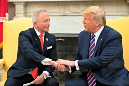 WASHINGTON, DC DECEMBER 19: (L-R) U.S. Rep. Jeff Van Drew of New Jersey, who has announced he is switching from the Democratic to Republican Party, shakes hands with U.S. President Donald Trump in the Oval Office of the White House on December 19, 2019 in Washington, DC. Van Drew voted …