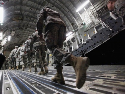 NASIRIYAH, IRAQ - DECEMBER 17: Soldiers from the 3rd Brigade, 1st Cavalry Division board a C-17 transport plane to depart from Iraq at Camp Adder, now known as Imam Ali Base, on December 17, 2011 near Nasiriyah, Iraq. Around 500 other troops from the 3rd Brigade, 1st Cavalry Division ended …