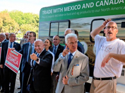 US Representative Kevin Brady (C) poses for photos with his colleagues after a rally for the passage of the US-Mexico-Canada Agreement (USMCA) near the US Capitol in Washington, DC, on September 12, 2019. (Photo by Alastair Pike / AFP) (Photo credit should read ALASTAIR PIKE/AFP via Getty Images)