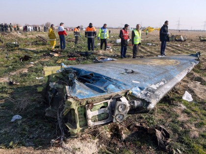 Rescue teams are seen on January 8, 2020 at the scene of a Ukrainian airliner that crashed shortly after take-off near Imam Khomeini airport in the Iranian capital Tehran. - Search-and-rescue teams were combing through the smoking wreckage of the Boeing 737 flight from Tehran to Kiev but officials said …