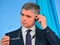 Ukrainian Foreign Minister Vadym Prystaiko adjusts his headphones as he gives a joint press conference with his German counterpa