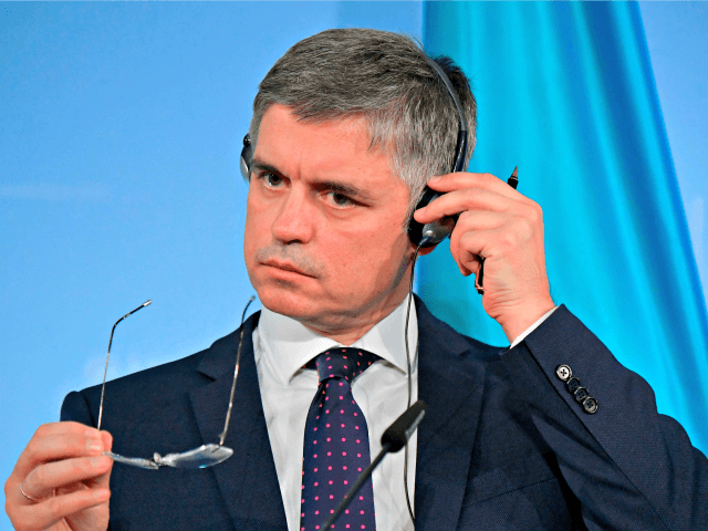 Ukrainian Foreign Minister Vadym Prystaiko adjusts his headphones as he gives a joint pres