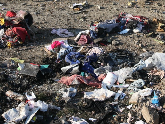 EDITORS NOTE: Graphic content / Personal belongings and debris are pictured scattered on t