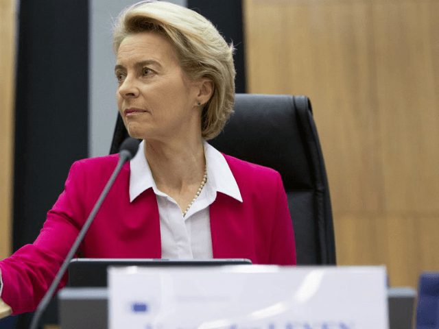 European Commission President Ursula von der Leyen rings a bell to signal the start of an