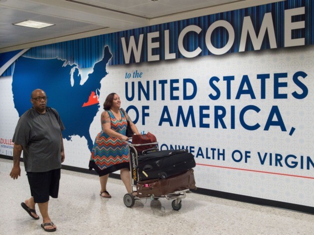 International travelers leave the Customs and Immigration area of Dulles International Air