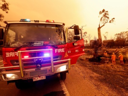 EAST GIPPSLAND, AUSTRALIA - JANUARY 04: Fire crews put out spot fires on January 04, 2020 in Sarsfield, Australia. Two people are dead and 28 remain missing following bushfires across the East Gippsland area, with Victorian premier Daniel Andrews declaring a state of disaster in the region. Thousands of people …
