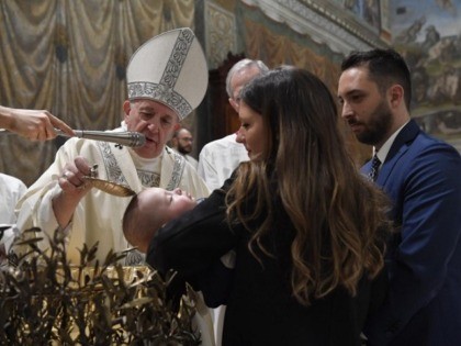 Pope baptizes children in Sistine Chapel.