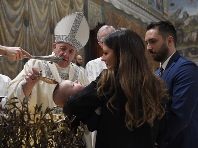 Pope baptizes children in Sistine Chapel.