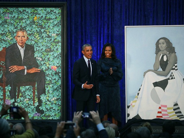 WASHINGTON, DC - FEBRUARY 12: Former U.S. President Barack Obama and former first lady Michelle Obama stand next to their newly unveiled portraits during a ceremony at the Smithsonian's National Portrait Gallery, on February 12, 2018 in Washington, DC. The portraits were commissioned by the Gallery, for Kehinde Wiley to …