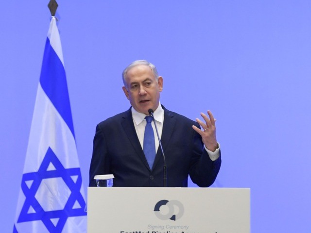 Israel's Prime Minister Benjamin Netanyahu (R) speaks during a press conference with Greek Prime Minister Kyriakos Mitsotakis (L) in Athens on January 2, 2020 following the signing ceremony of an agreement for the EastMed pipeline project designed to ship gas from the eastern Mediterranean to Europe in Athens on January …