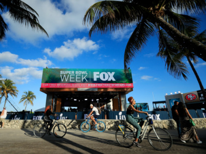 Cyclists ride past the FOX Sports South Beach studio compound prior to Super Bowl LIV on January 25, 2020 in Miami Beach, Florida. The San Francisco 49ers will face the Kansas City Chiefs in the 54th playing of the Super Bowl, Sunday February 2nd. (Photo by Cliff Hawkins/Getty Images)