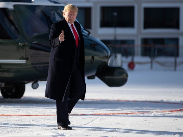 US President Donald Trump gestures as he arrives in Davos, Switzerland on Marine One, Tues