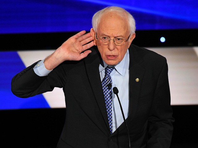 (L-R) Democratic presidential hopeful Vermont Senator Bernie Sanders speaks during the sev