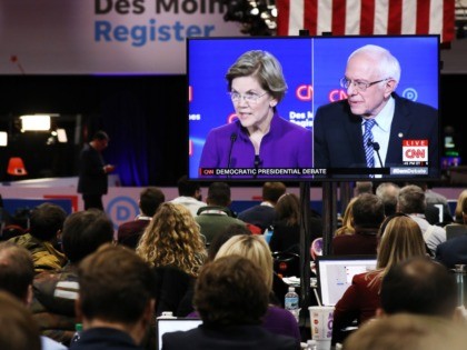 DES MOINES, IOWA - JANUARY 14: Members of the media watch the CNN Democratic Presidential Debate on January 14, 2020 in Des Moines, Iowa. Six candidates out of the field qualified for the first Democratic presidential primary debate of 2020, hosted by CNN and the Des Moines Register. (Photo by …