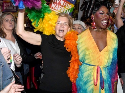 LAS VEGAS, NEVADA - OCTOBER 11: Democratic presidential candidate and U.S. Sen. Elizabeth Warren (D-MA) (L) and drag queen Shea Coulee march with Warren supporters in the Southern Nevada Association of Pride Inc. 22nd annual PRIDE Night Parade on October 11, 2019 in Las Vegas, Nevada. Recent national presidential primary …